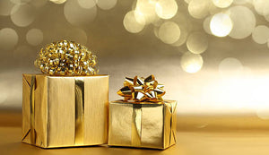 Gold wrapped gifts with gold ribbon and bows